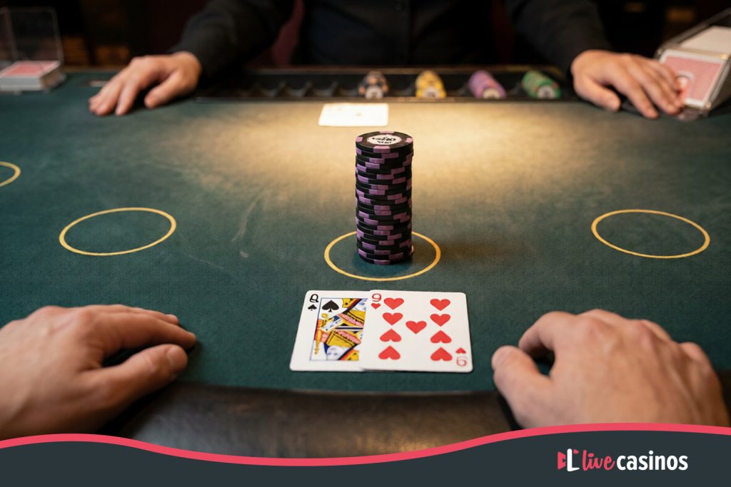 High-limit blackjack table with a large stack of high-denomination casino chips placed as a single wager